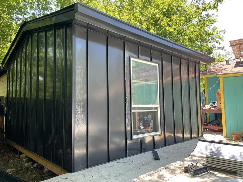 Black standing seam metal wall panels for Roof Inspection in Denison