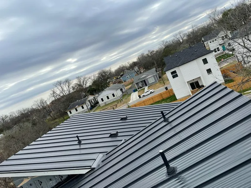 Standing seam metal roof panels with vents for Skylight Repair in Denison